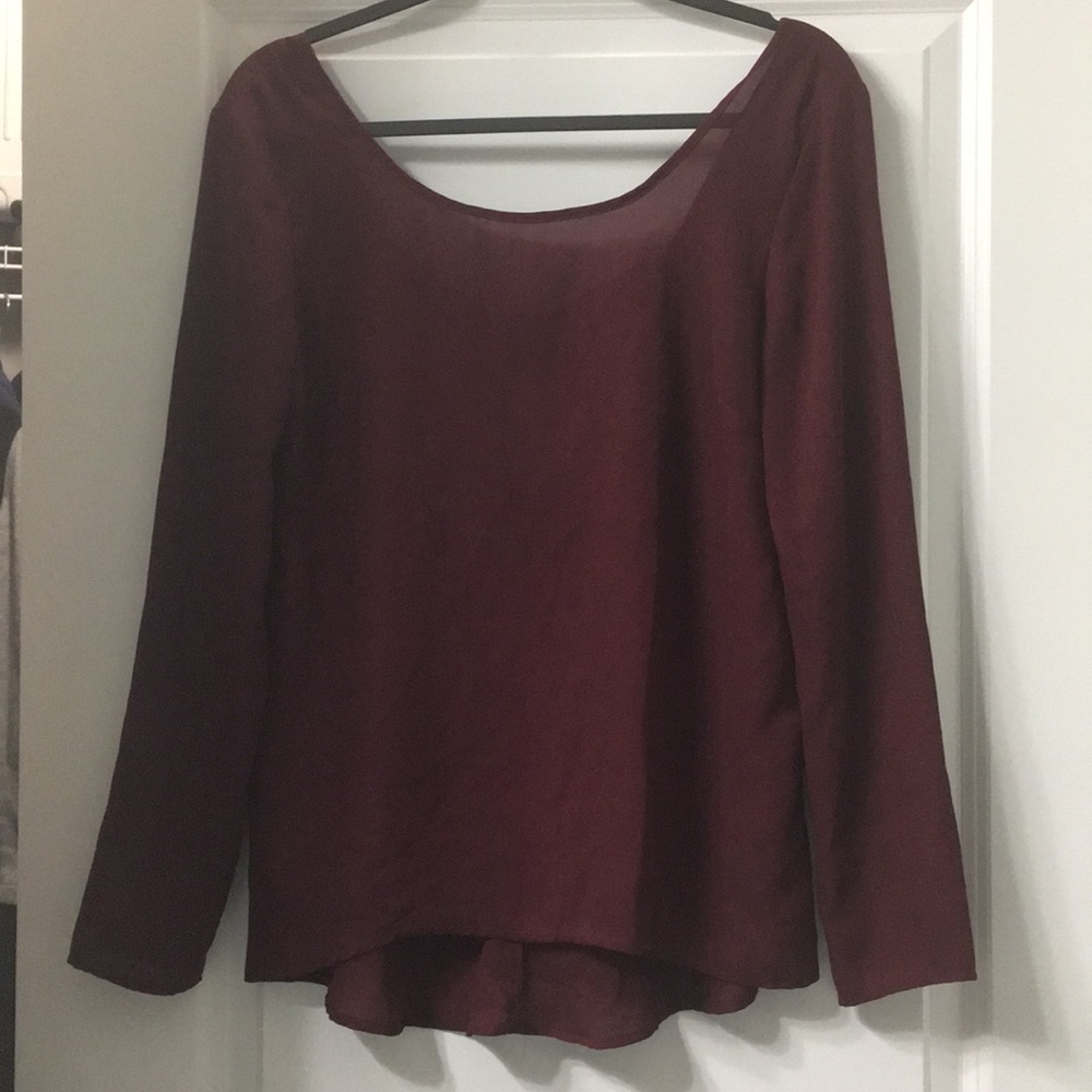 Blouse with bow in the back.